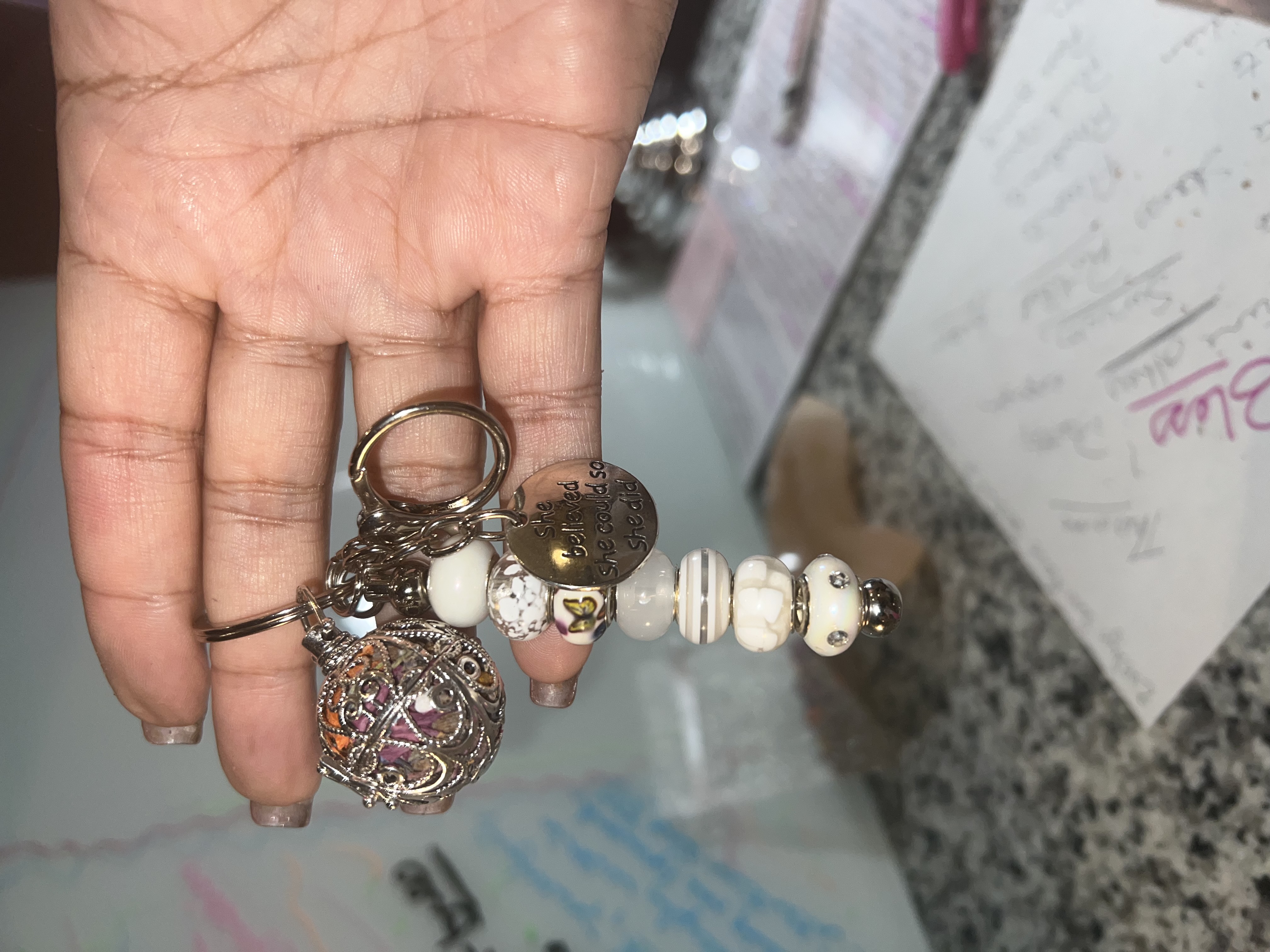 A channeled keychain held in hand