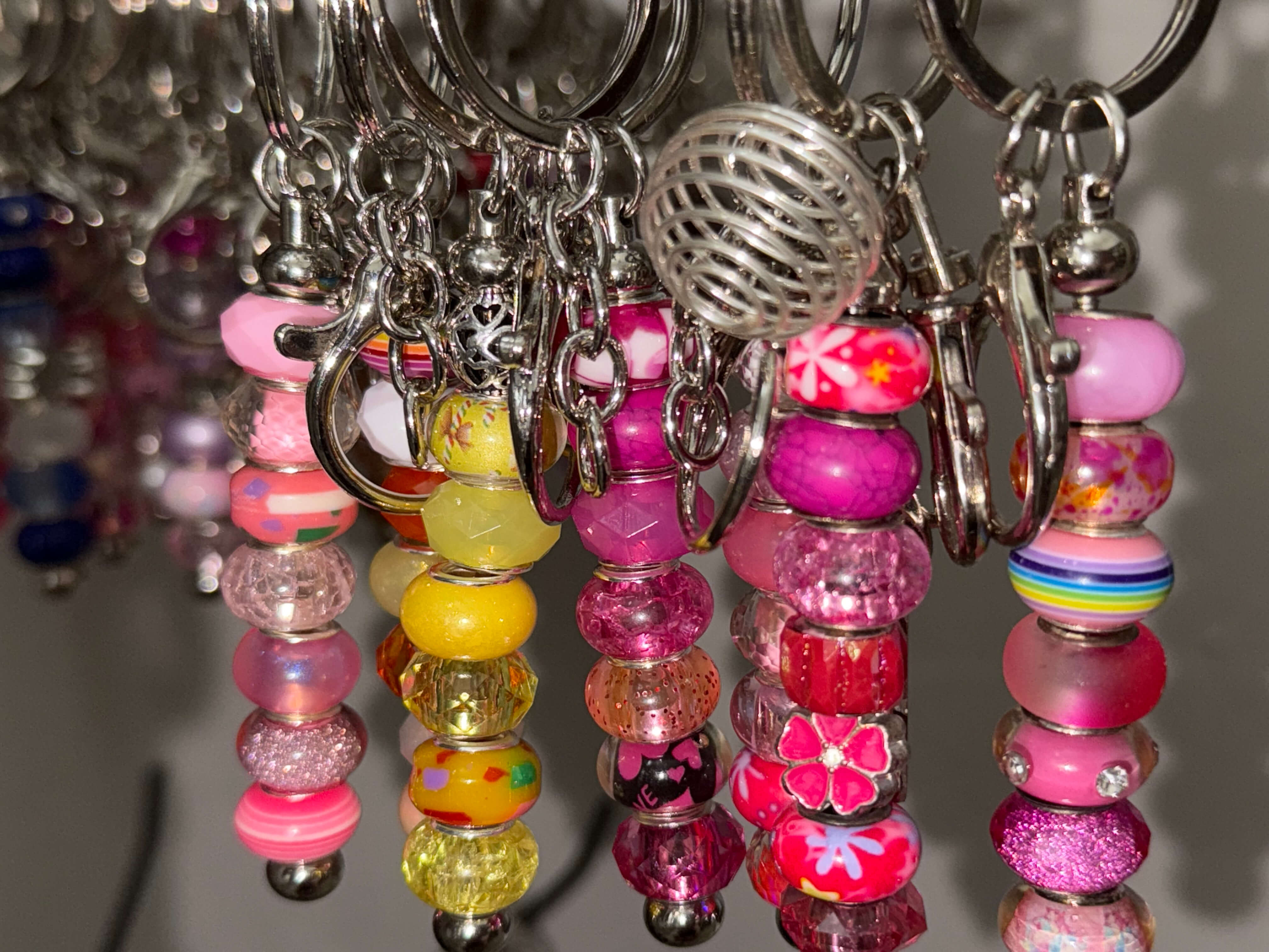 Glass-bead keychains in rose tones