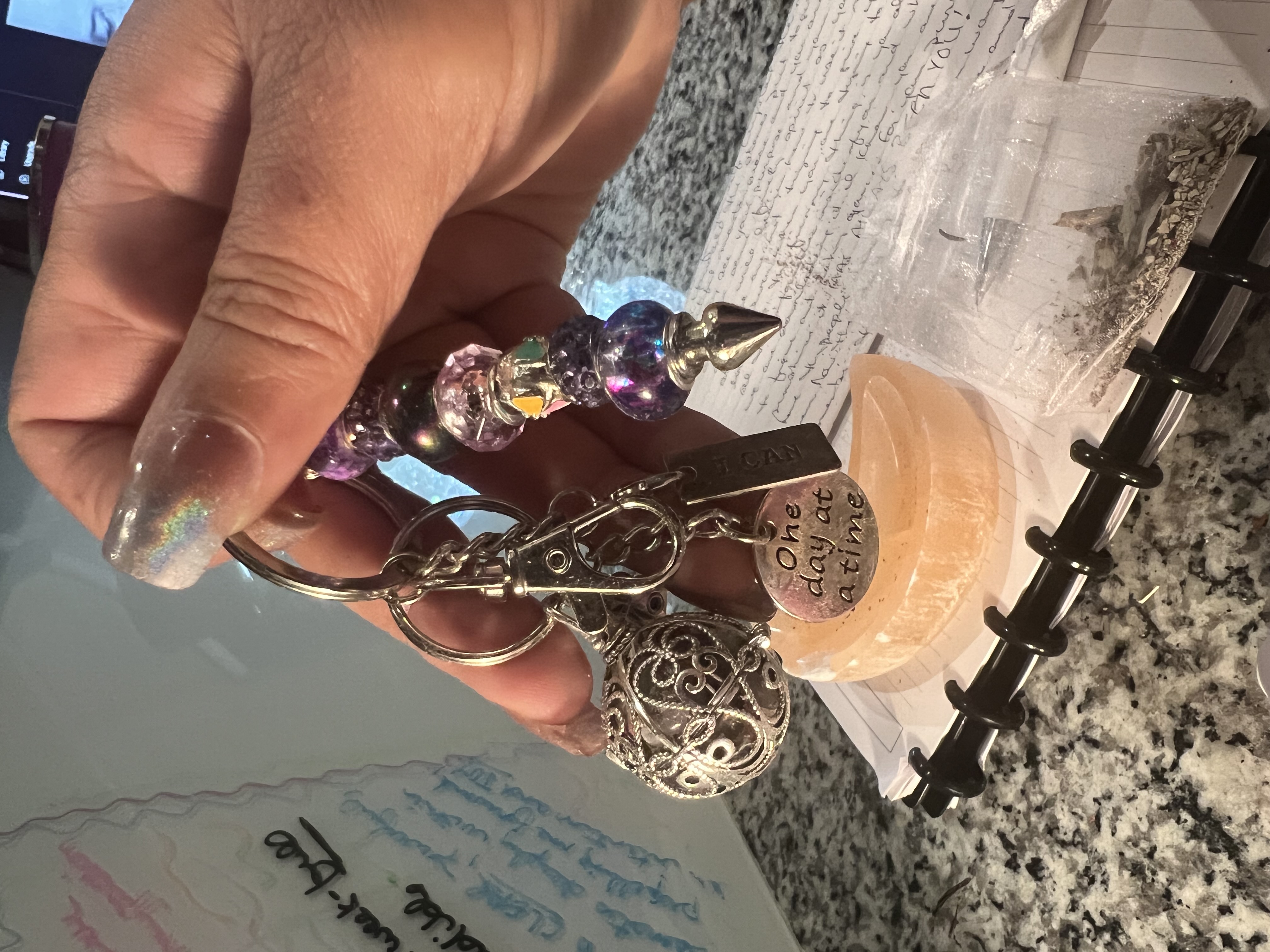 Amethyst-toned keychain on a selenite moon